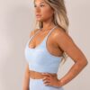 Four blue sports bra side